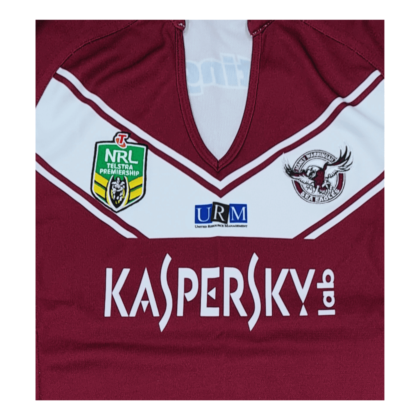 A maroon rugby jersey with the word kaspyk on it. This jersey is a Ladies size 14 and features the iconic Manly Sea Eagles logo, making it the perfect ISC Manly Sea Eagles 2013/2015 Home Jersey.