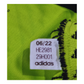 A close up photo of the Adidas Third Jersey label on a green shirt featuring the Manchester United 2022/23 Third Jersey logo.