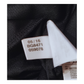 A close up of a 2016 Adidas label on a black Besiktas 2016 Away Jersey.
