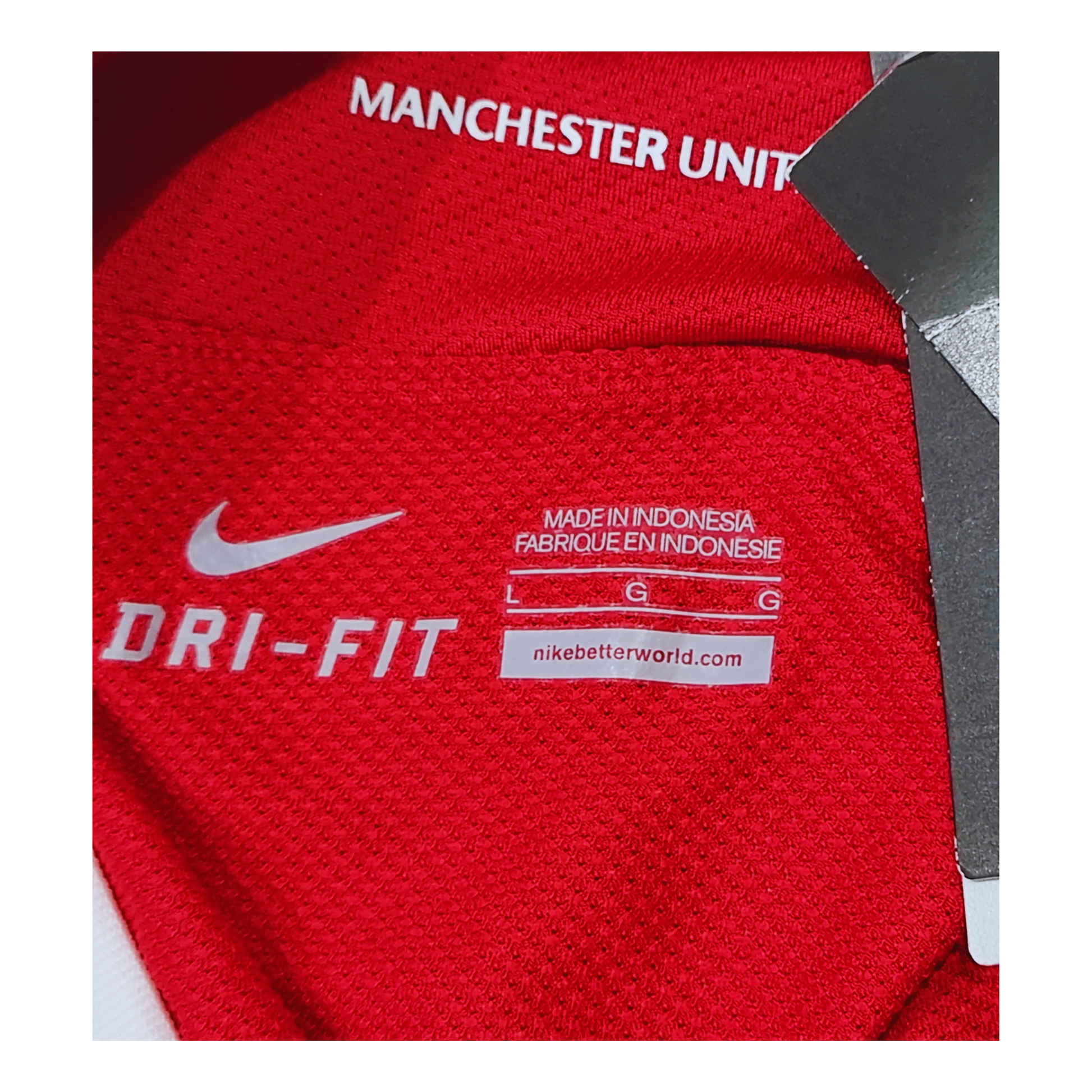 The back of a Manchester United 2011/12 Home Jersey, made with Nike's dri-fit technology.